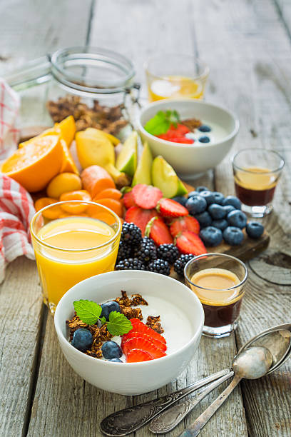 istock Breakfast - yogurt with fruits granola and coffee 577644598