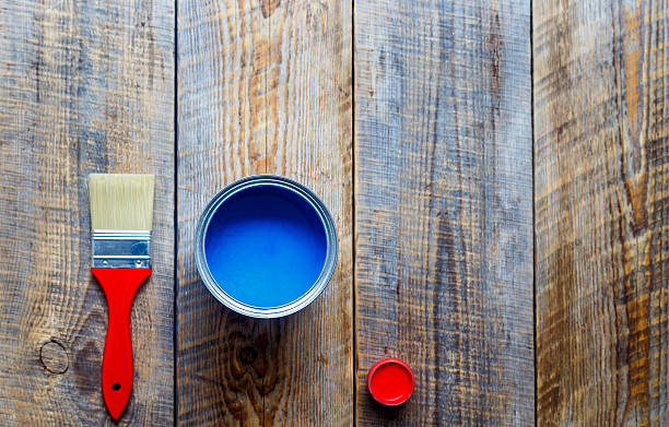 istock concept preparation for painting with can of blue paint 577644722