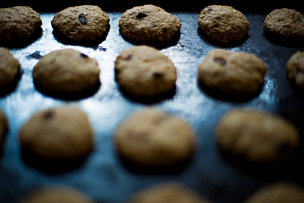 istock Oatmeal cookies with chocolate on baking sheet 577645082