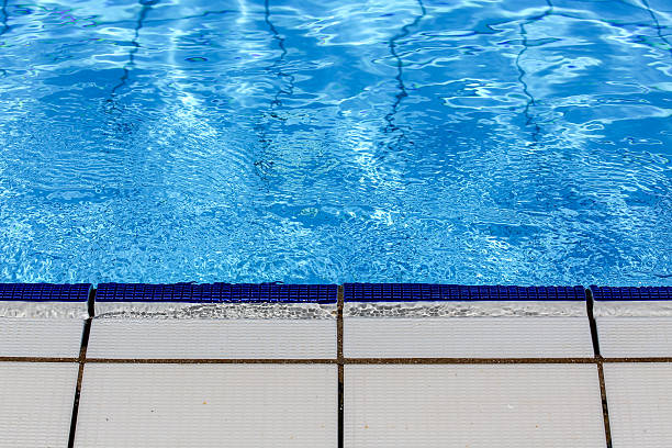 istock Swimming pool blue water with floor 577645490