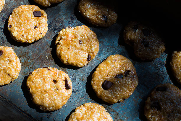 istock Oatmeal cookies with chocolate on baking sheet 577646838