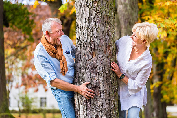 istock Senior woman having walk in autumn park 577648996