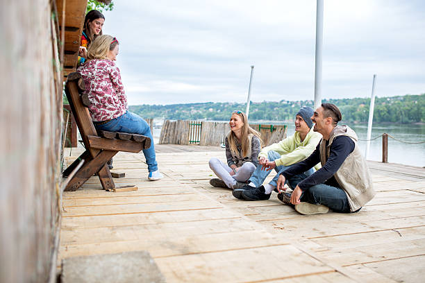 istock Group of happy friends spending a day outdoors together. 577651038