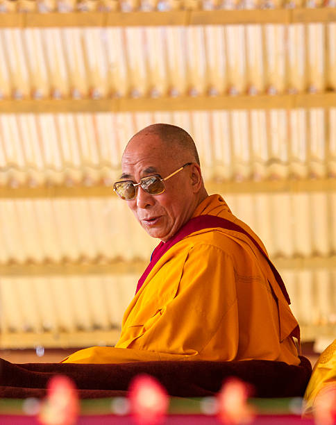 Dalai Lama is friendly looking at the listeners Leh, India - August 7, 2012: His Holiness the 14th Dalai Lama is friendly looking at the listeners at the His Holiness teachings in Leh,  India lama religious occupation stock pictures, royalty-free photos & images