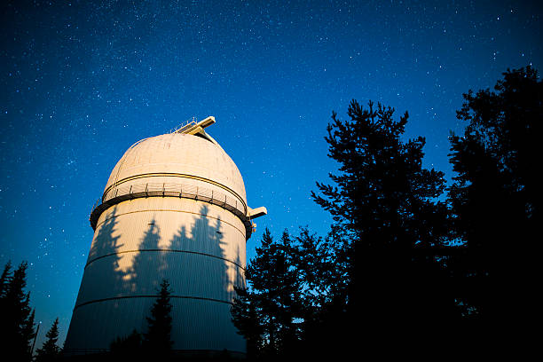 istock Astronomical Observatory under the night sky stars. Vignette 577652264