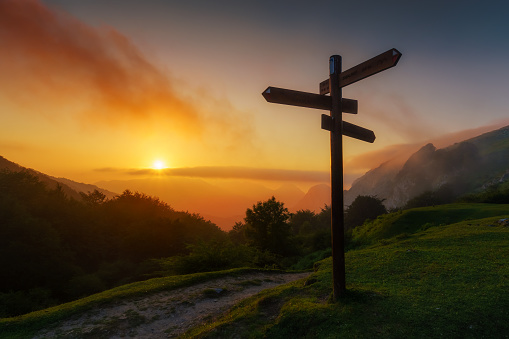 signpost in the mountain at sunset