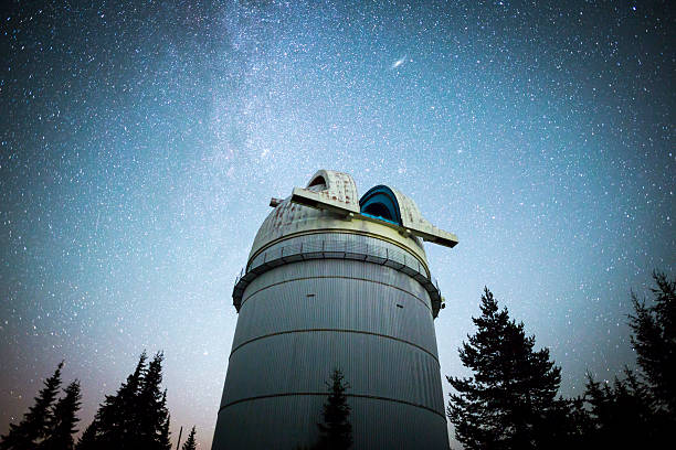 istock Astronomical Observatory under the night sky stars. Vignette 577652588