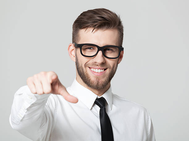 istock Young handsome businessman pointing at you isolated. 577653664