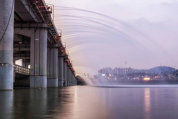 banpo rainbow bridge fountain show taken during sunset hours. Banpo bridge fountain show is situated on the han river.