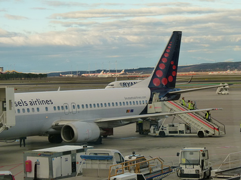 Madrid, Spain - January 2, 2011: Brussels airlines aircraft at Madrid Barajas airport. There's also a Ryanair aircraft on the background.