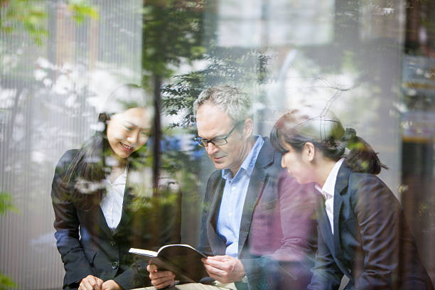 istock Going over the business minutes together 577656836