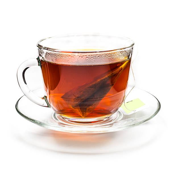 istock Transparent cup of tea with tea bag on white 577658790