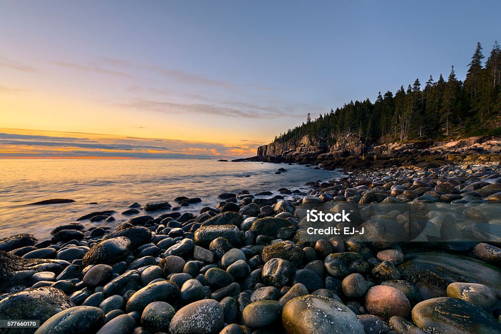 Rocky Coast of Maine in Autumn Rocky beach in Acadia National Park, Maine with view of Otter Cliffs at sunrise. Maine Stock Photo