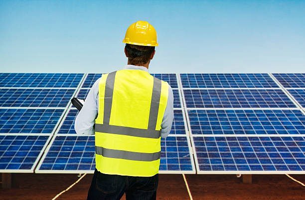 istock Rear view of solar manager standing 577662210