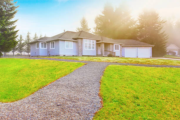 istock Nice modern house with driveway and well kept lawn around 577931994