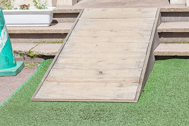istock Wooden ramped access, using wheelchair ramp for disabled people. 577932078