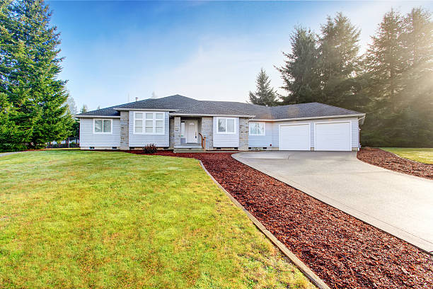 istock Nice modern house with driveway and well kept lawn around 577932342