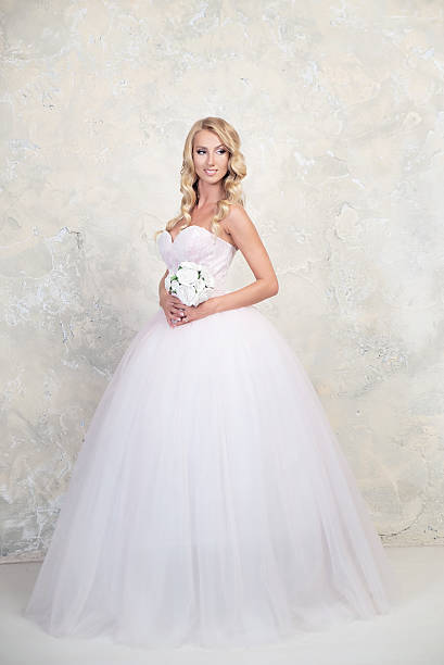 istock Bride in white wedding dress. Blonde 577933086
