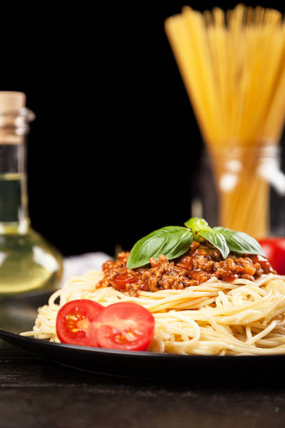 istock Spaghetti bolognese on dark background 577933936