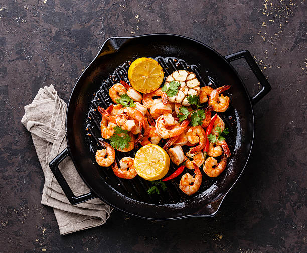 istock Prawns frying pan with lemon and garlic 577933952