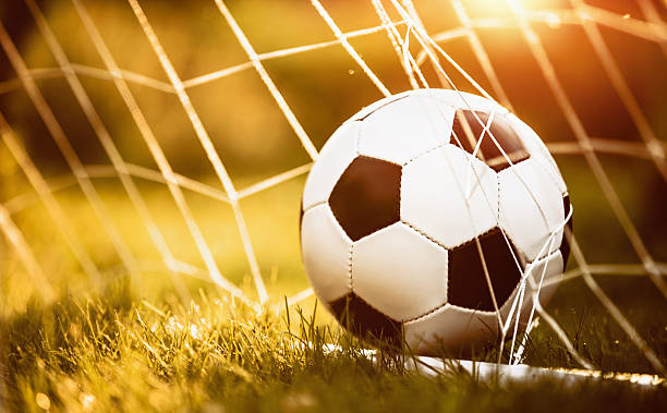 istock Soccer ball in goal 577934016