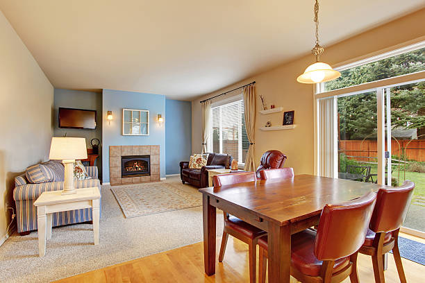 istock Cozy living room with carpet floor and fireplace 577934706