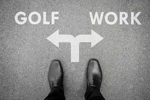 istock Black shoes at the crossroad - golf or work 577936422