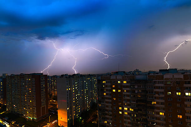 istock Storm clouds, heavy rain. Thunderstorm and lightning over the city. 577936502