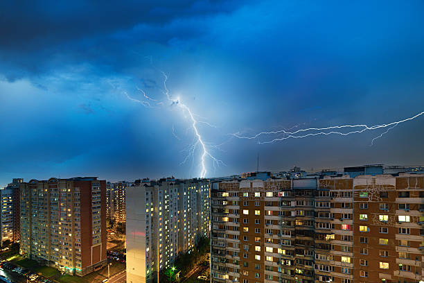 istock Storm clouds, heavy rain. Thunderstorm and lightning over the city. 577936728
