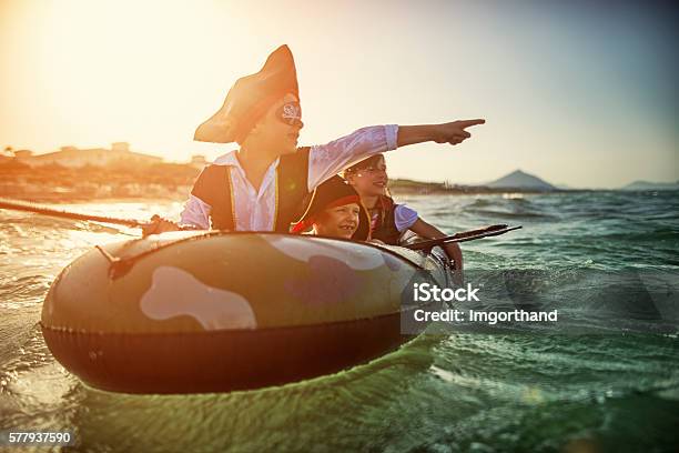 Kids Playing Pirates At Sea On A Boat-foton och fler bilder på Barn - Barn, Pirat, Pojkar