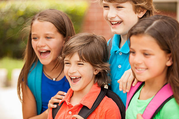 istock Back to School:  Elementary-age children, friends on school campus. 577938850