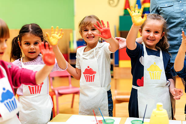 istock Children Painting Their Hands With Watercolors 577940074