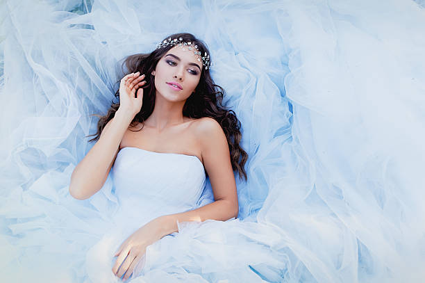 istock The brunette is lying in a dress, . The view from 577940130