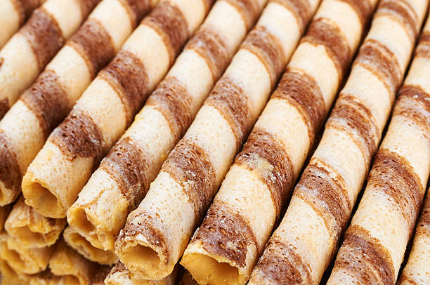 istock Striped wafer rolls filled with vanilla cream 577940306