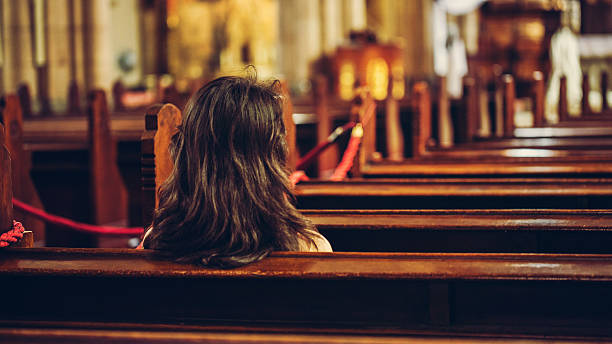 istock church and woman 577941304