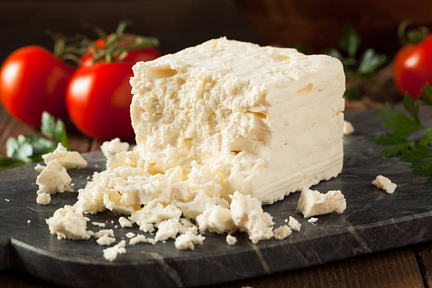 Raw Organic White Feta Cheese Raw Organic White Feta Cheese for Crumbling feta cheese block stock pictures, royalty-free photos & images