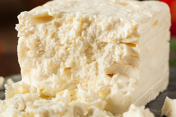 Raw Organic White Feta Cheese Raw Organic White Feta Cheese for Crumbling feta cheese block stock pictures, royalty-free photos & images