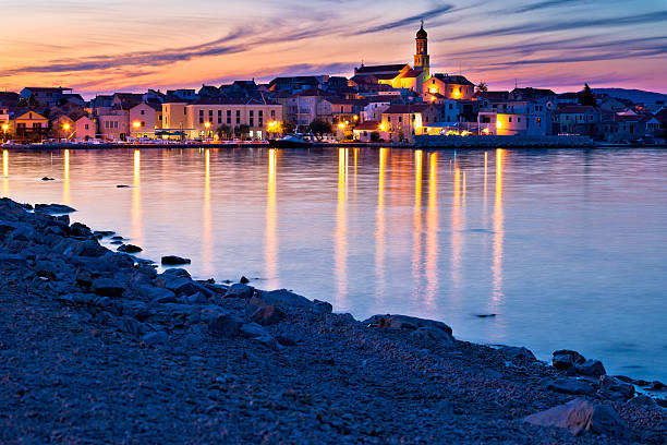 istock Betina town and beach sunset view 577947872