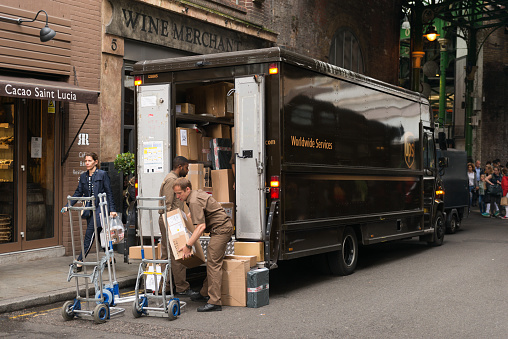 London, United Kingdom - June 17, 2016: The Borough Market in Southwark late in the day as UPS delivers packages.