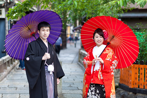 Kyoto,Japan- May 24,2016:Japanese couple in traditional cloths walking in the Gion district in Kyoto.