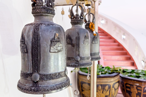 Row of Thai style bells in buddhist temple. Golden Mount temple, Bangkok, Thailand.