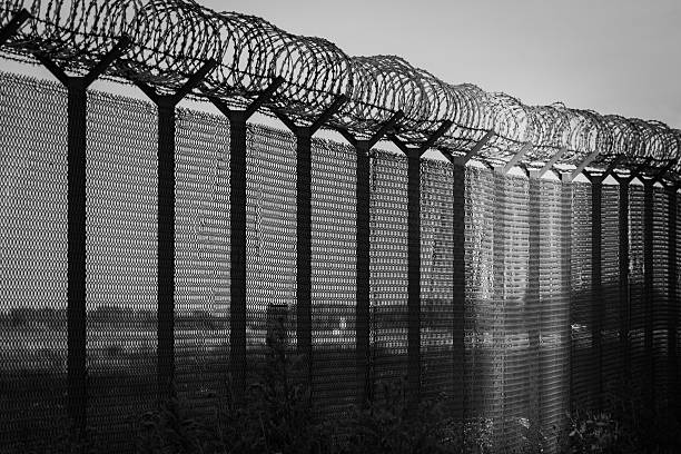 istock Light of hope - restricted area, black and white 577950814