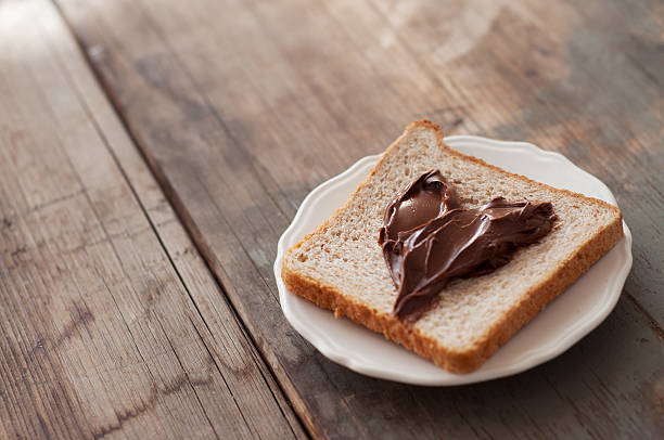 istock Sunday breakfast. Toast and peanut butter. 577952252