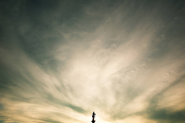 Jardin du Luxembourg, statue silhouette against dramatic sunset sky. The Jardin du Luxembourg, or the Luxembourg Garden, located in the 6th arrondissement of Paris, was created beginning in 1612 by Marie de' Medici, the widow of King Henry IV of France, for a new residence she constructed, the Luxembourg Palace. The garden today is owned by the French Senate, which meets in the Palace.