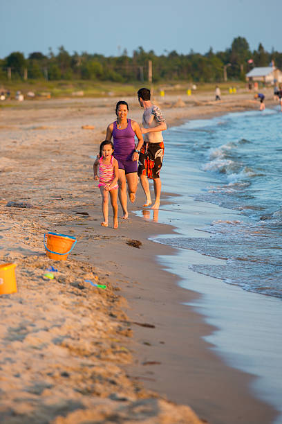 istock Mixed race family at the beach 577954402