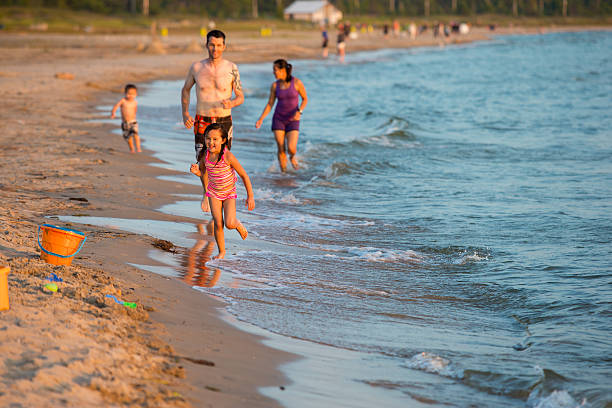 istock Mixed race family at the beach 577954634