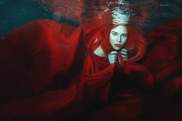 istock Woman swims underwater. 577954638