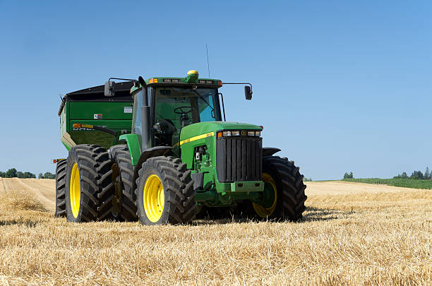 Tractor in Wheat Field stock photo