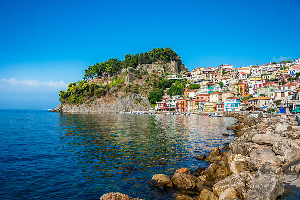 Beautiful Panoramic View of Parga Harbour, Greece Beautiful Panoramic View of Parga Harbour, Greece. Colorful and traditional houses over reflection in the Mediterranean Sea. parga greece stock pictures, royalty-free photos & images