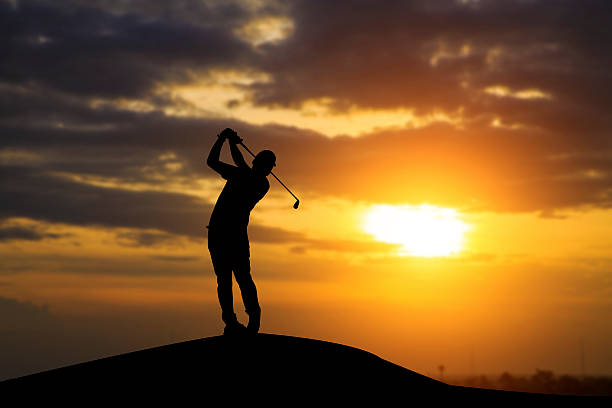 istock silhouette of golfers hit sweeping and keep golf course 577956412